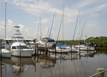 A group of boats docked at the dock.