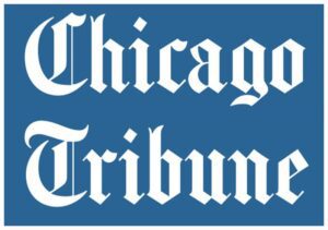 A chicago tribune logo with the word chicago tribune written in white.